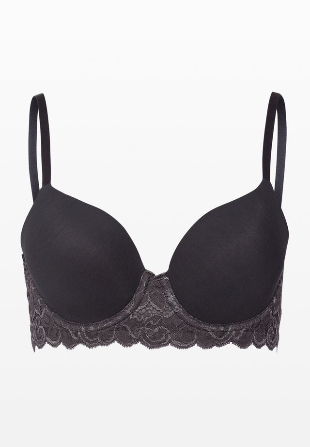 Black bra with lace trim on a white background