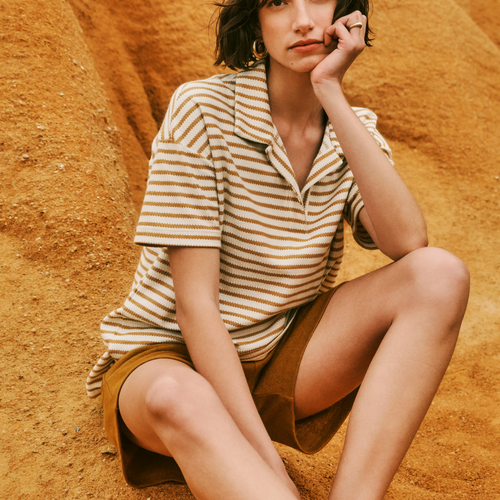 Women sitting on sand dune wearing Summer Knits Organic Cotton Collared Top in  Golden Cumin Stripe