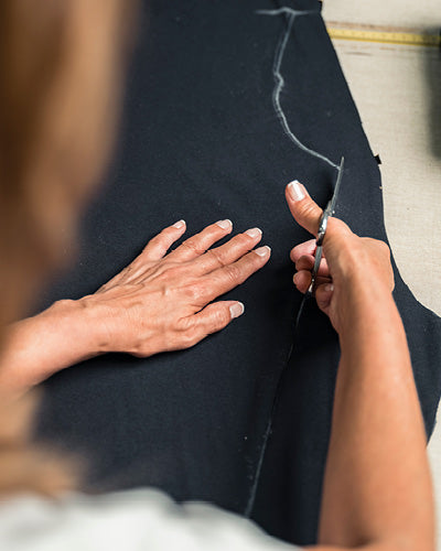 cotton seamless fabric being hand-cut in production process