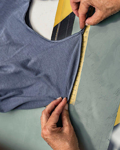 cotton seamless camisole being measured in production process