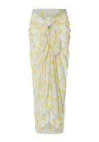 Yellow and white patterned pareo on a white background