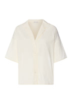 Light yellow blouse on a white background