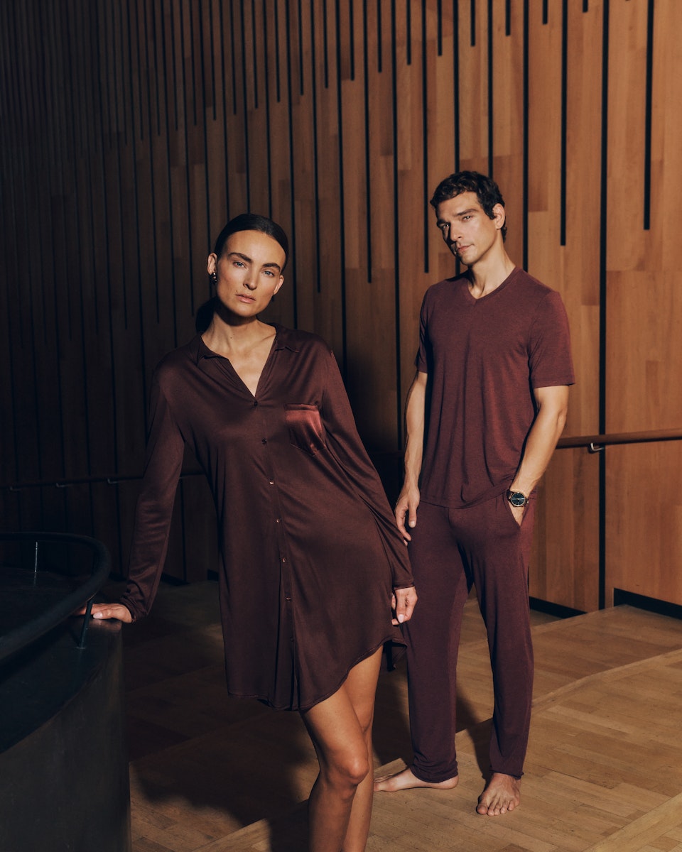 Two people wearing Grand Central Sleep Shirt and Casuals Shirt and pants in vivid brown.