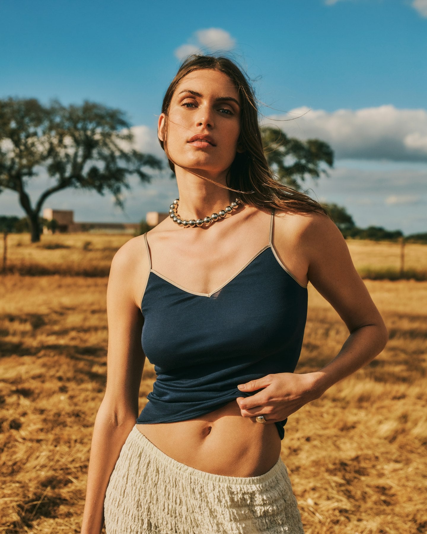 Women standing in a field wearing Style Icon Cotton Seamless V-Neck Cotton Camisole  in Deep Navy. 