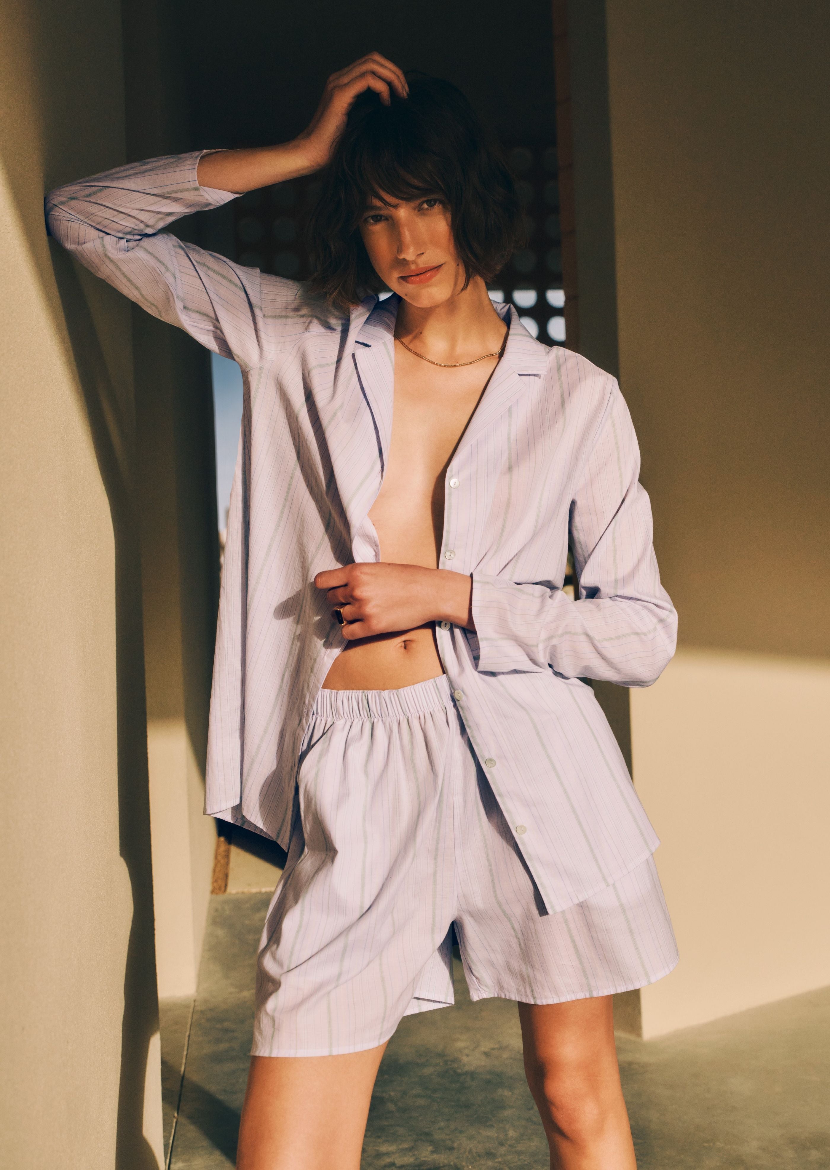 Women posing against wall with Sleep and Lounge Button Front Shirt unbuttoned, paired with Sleep and Lounge Shorts in Pastel  Dream