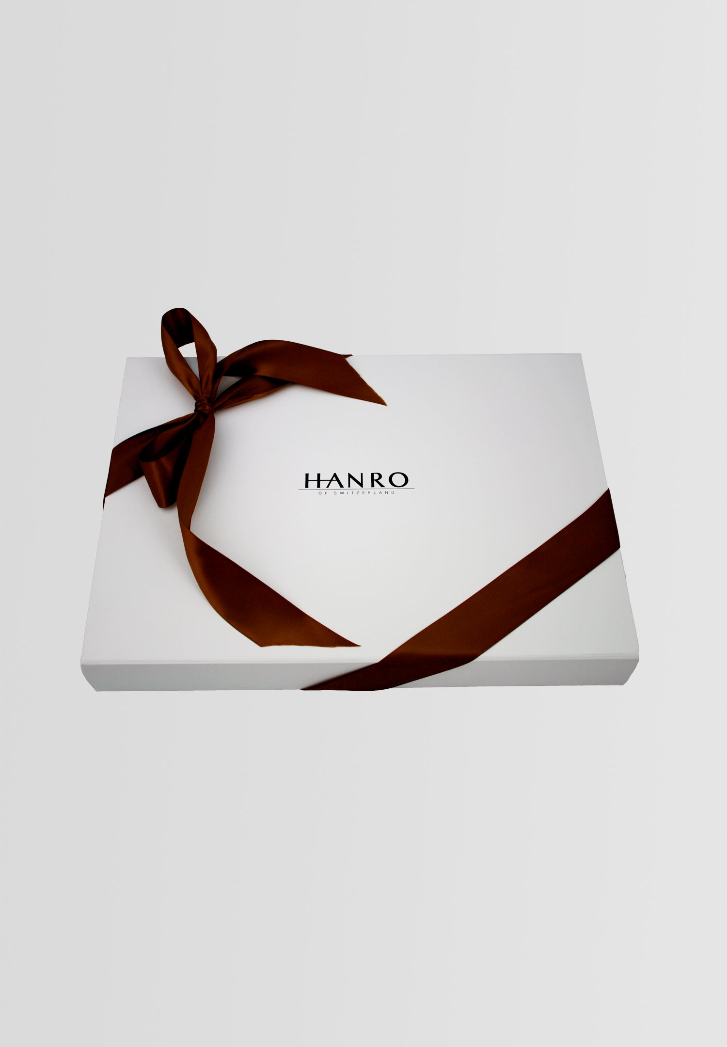 HANRO White Gift Box with black text tied with a burgundy ribbon into a bow