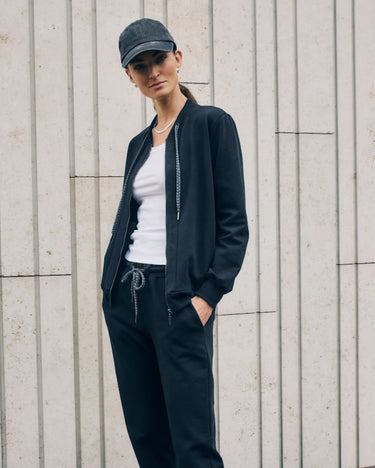 Women wearing Natural Living Jacket in Black Pearl and matching joggers