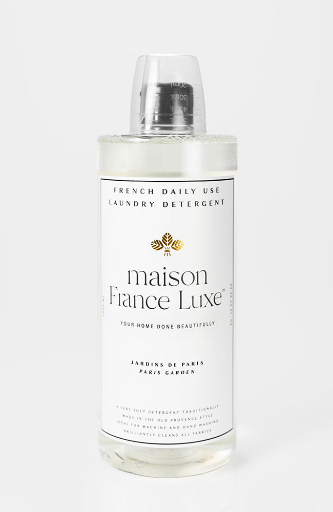 Bottle of maison Fiance Luxe laundry detergent on a white background