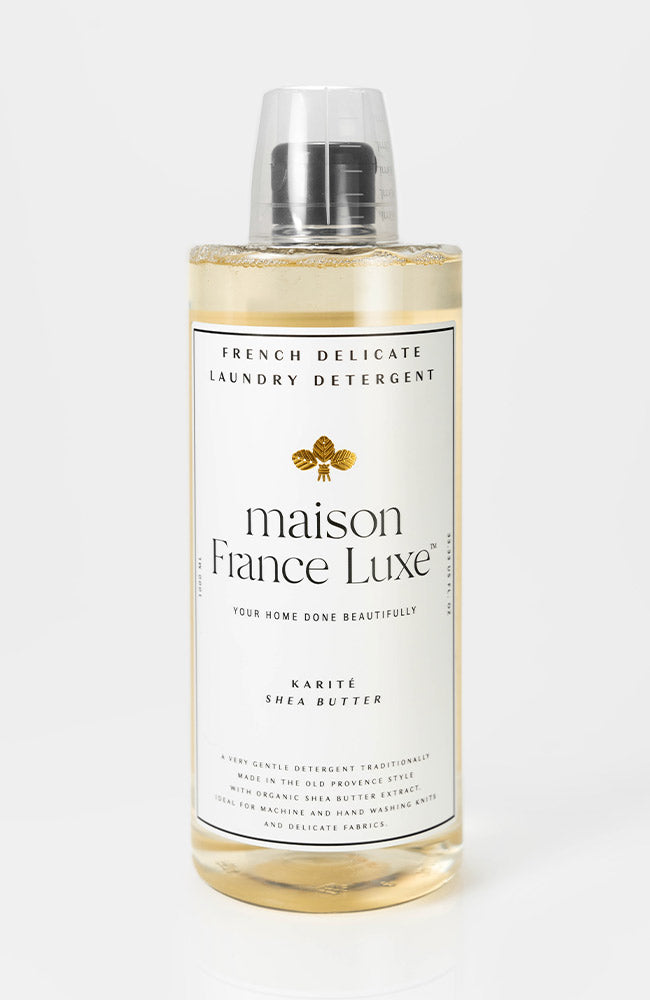 Bottle of maison France Luxe laundry detergent on a white background