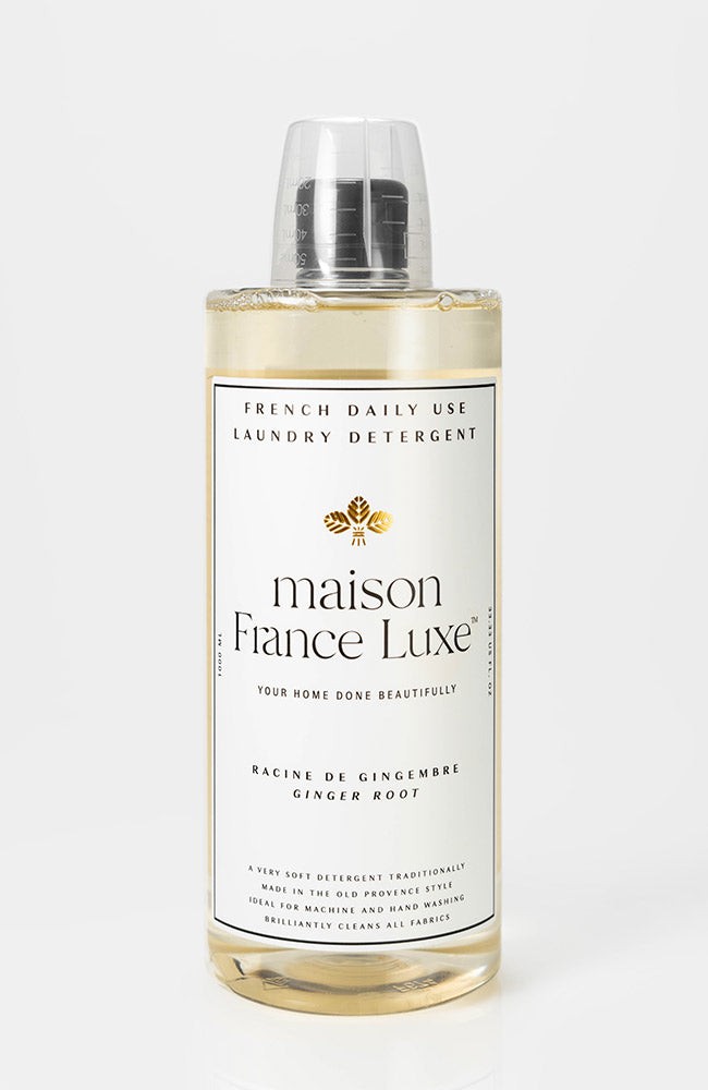 Bottle of maison France Luxe laundry detergent on a white background