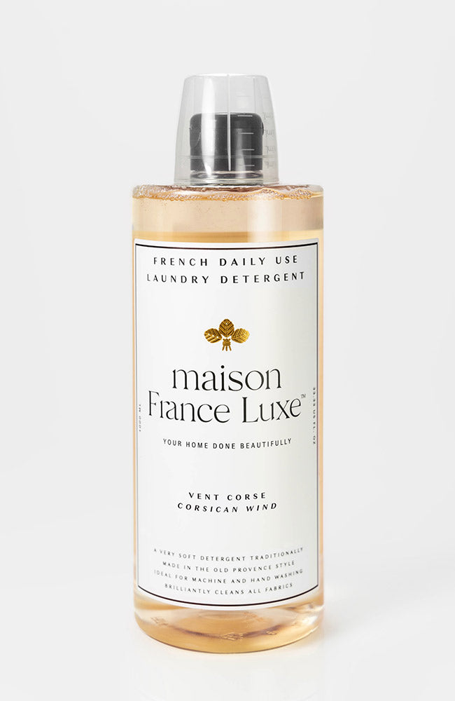 Bottle of maison Fiance Luxe laundry detergent on a white background